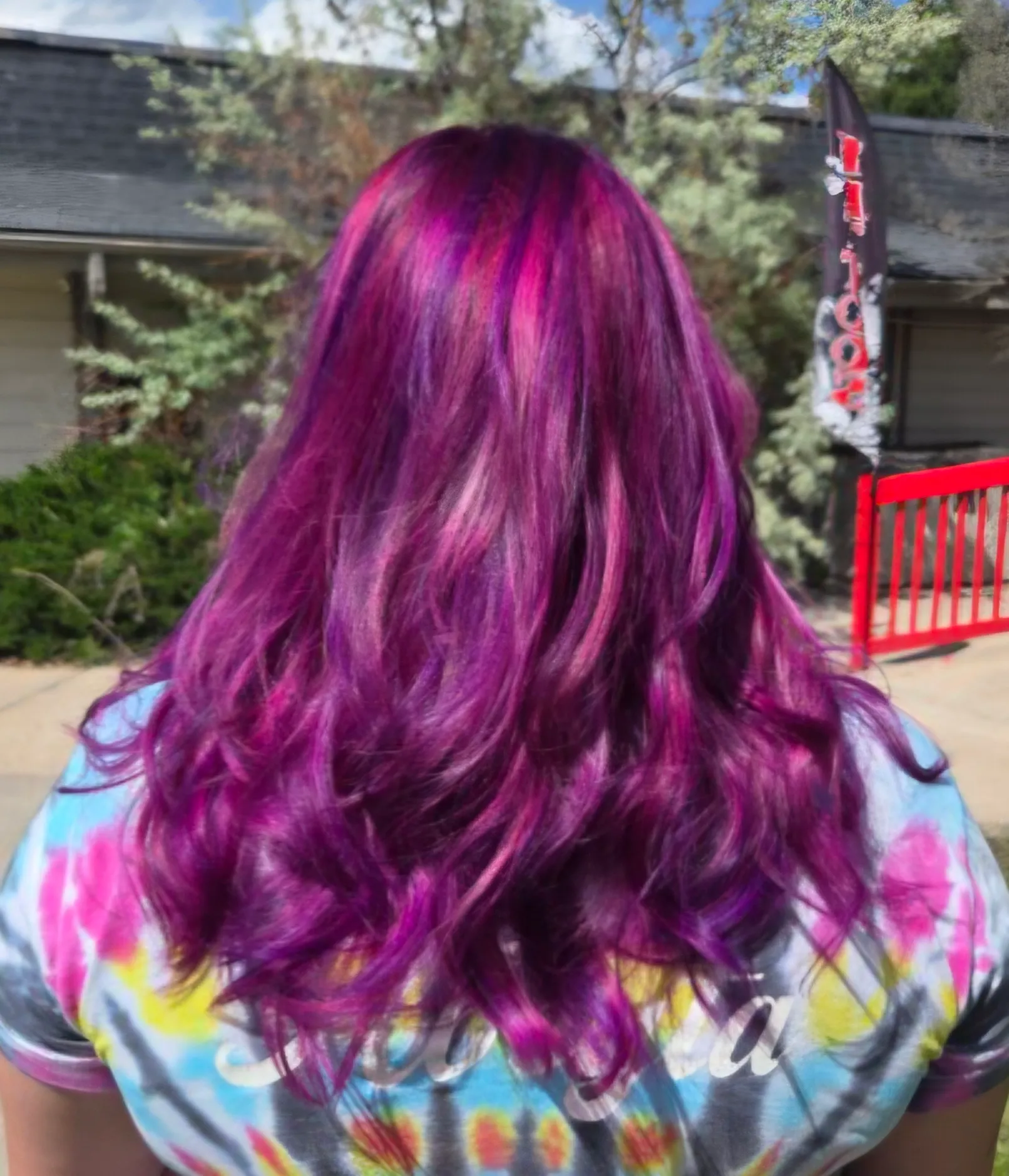 Magenta and purple waves shot through with pink ribbons